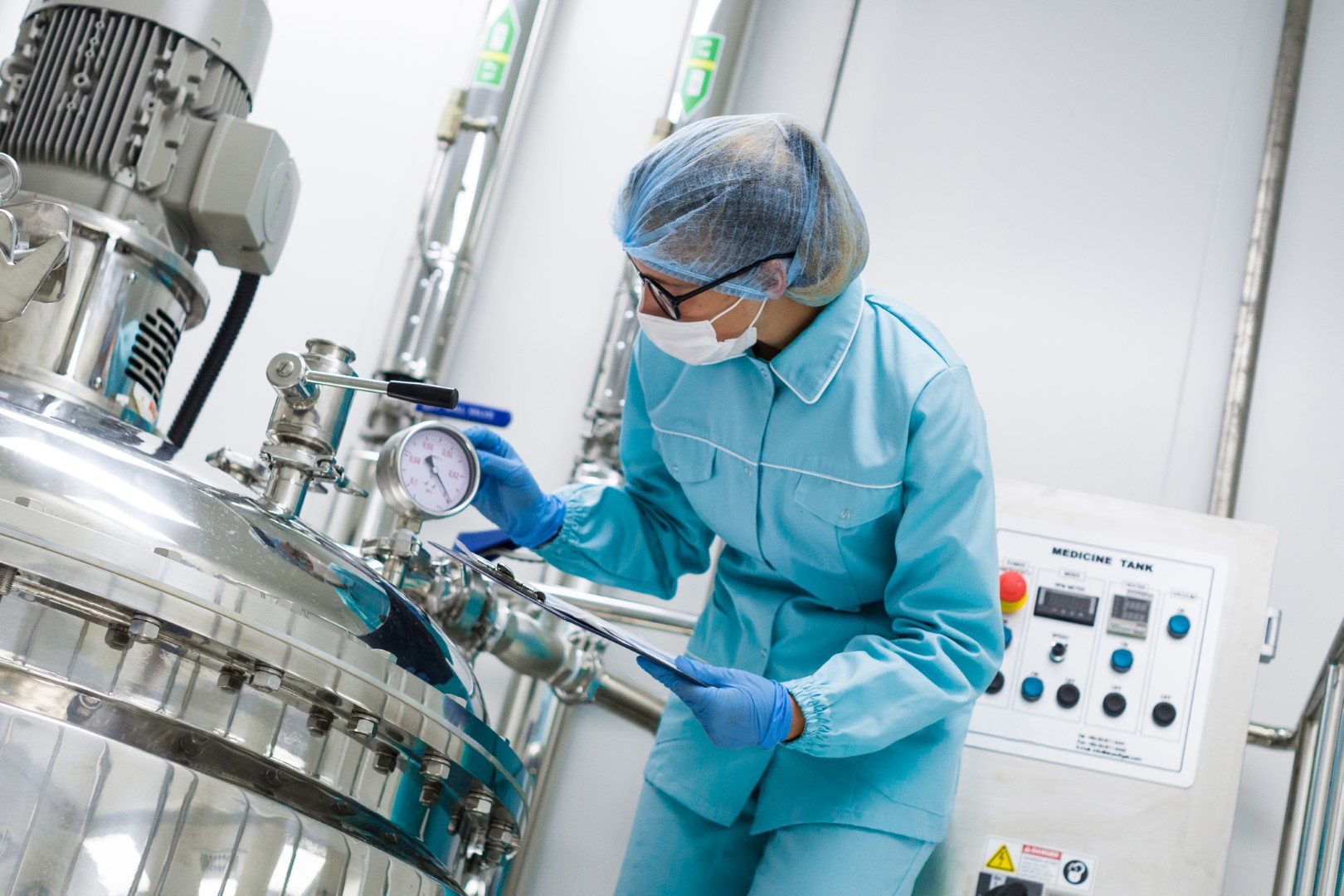 bended-scientist-blue-lab-uniform-check-how-compressor-tank-works-tablet-hands-close